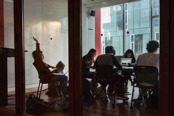 Stock photo of students sitting in a meeting room